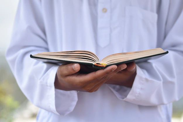 A Muslim man recites the Holy Quran