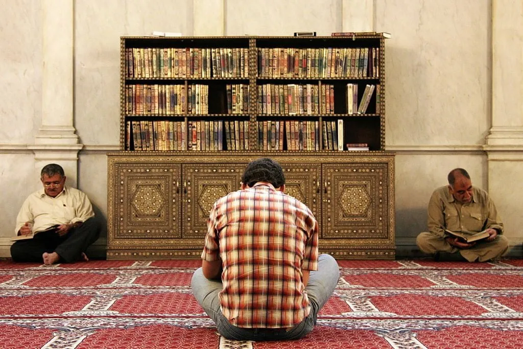 Muslim Men reading the Quran in Umayyad Mosque Damascus, Syria (1)