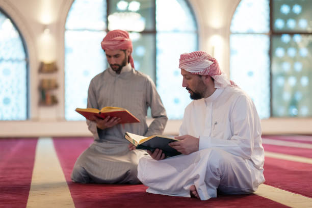 Two Muslims reciting Quran together
