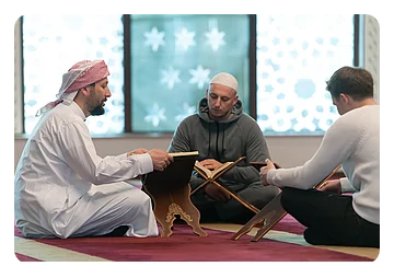 Muslim people in mosque reading Quran together