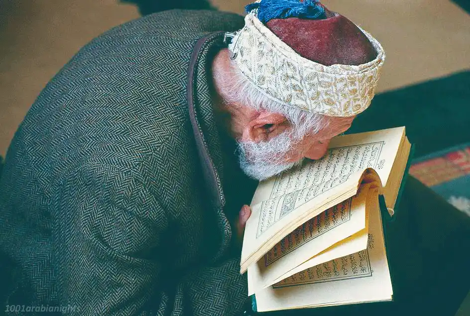 Muslim old man reading quran